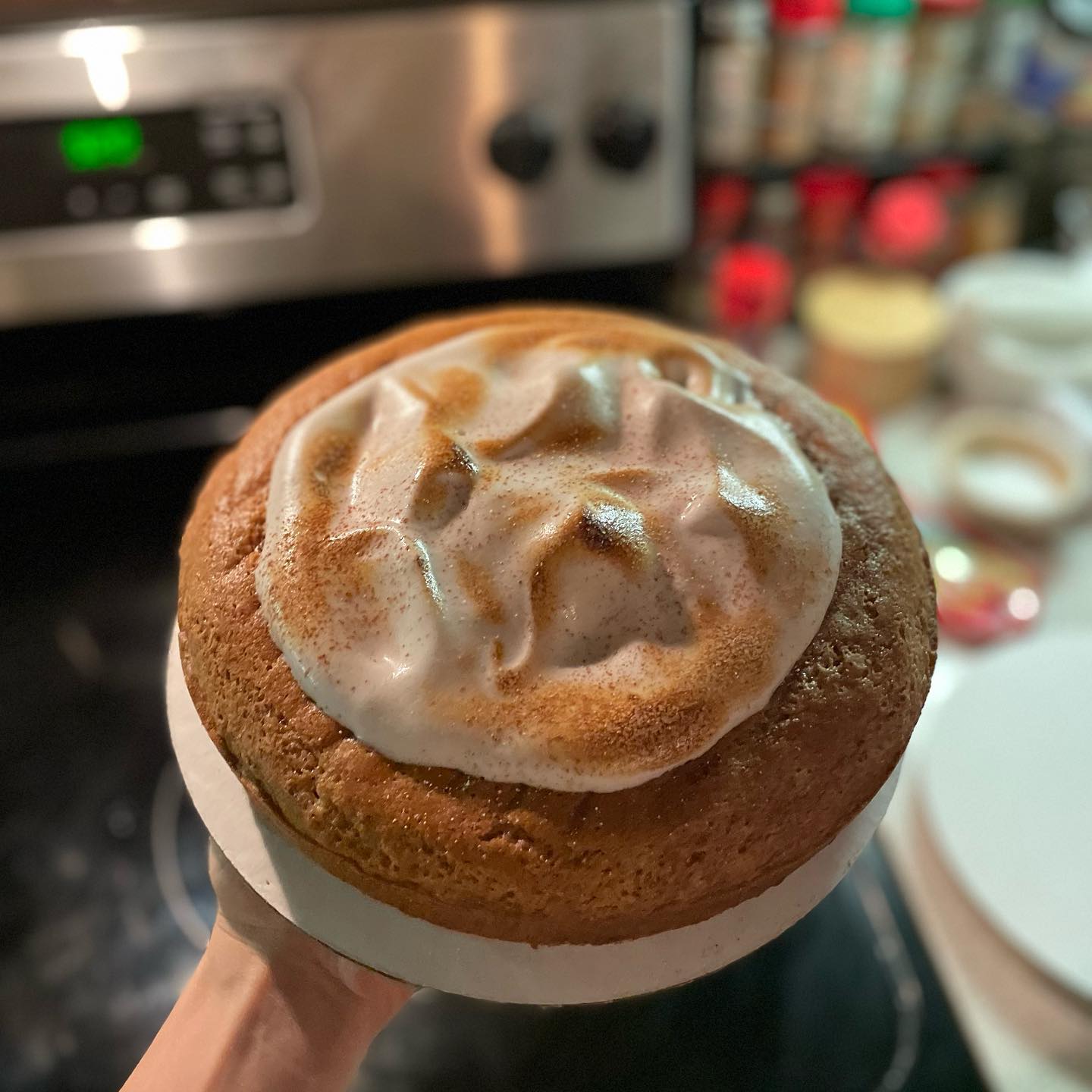 Olive oil cake with torched cinnamon meringue