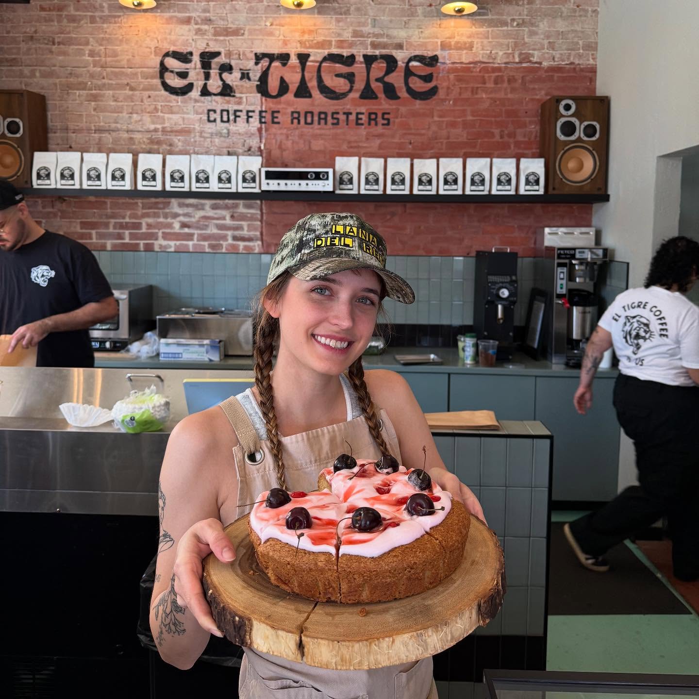 Hannah holding a cherry olive oil cake
